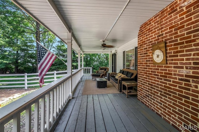 2466 State Road Ff, Eureka, MO 63025 - deck with an outdoor hangout area and a ceiling fan