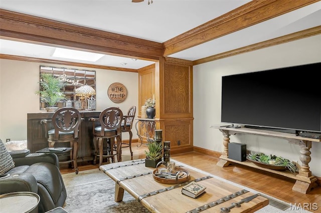 2466 State Road Ff, Eureka, MO 63025 - living room featuring crown molding, light wood-style flooring, a skylight, and bar