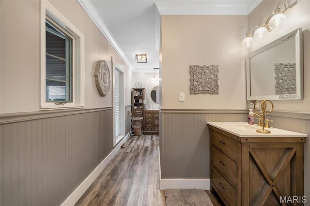 2466 State Road Ff, Eureka, MO 63025 - bathroom featuring wainscoting, two vanities, crown molding, and wood finished floors