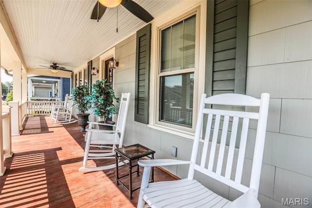 201 S Columbus St, Pacific, MO 63069 - wooden porch with ceiling fan