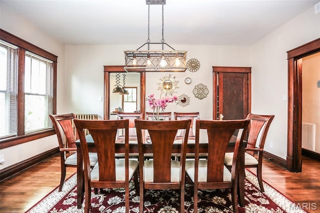 201 S Columbus St, Pacific, MO 63069 - dining space featuring dark wood-style flooring and baseboards