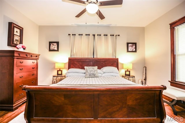 201 S Columbus St, Pacific, MO 63069 - bedroom with wood finished floors and a ceiling fan