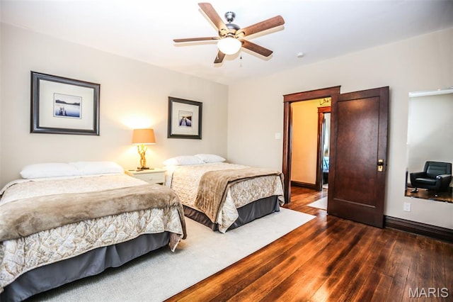 201 S Columbus St, Pacific, MO 63069 - bedroom with dark wood-style flooring and a ceiling fan