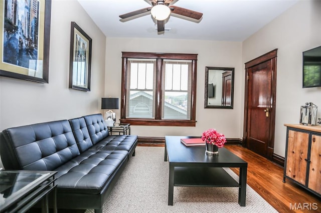 201 S Columbus St, Pacific, MO 63069 - living room featuring dark wood-style flooring and a ceiling fan