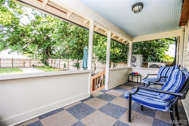 201 S Columbus St, Pacific, MO 63069 - sunroom / solarium featuring stacked washer / drying machine