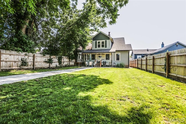 201 S Columbus St, Pacific, MO 63069 - rear view of house with a fenced backyard