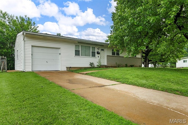 2185 Orleans Ln, Florissant, MO 63031 - view of front of house featuring a garage, driveway, and a front yard