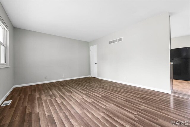 2185 Orleans Ln, Florissant, MO 63031 - spare room with wood finished floors