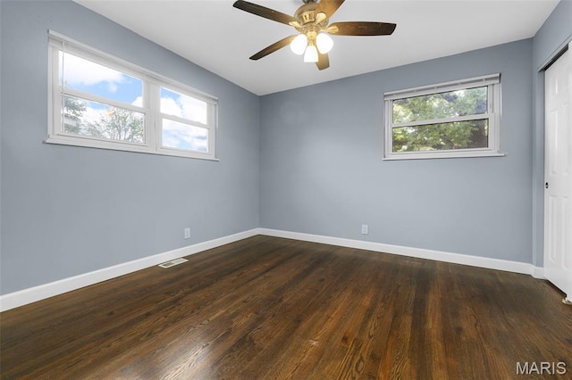 2185 Orleans Ln, Florissant, MO 63031 - empty room with dark wood-style floors and a ceiling fan