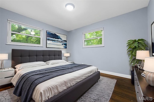 2185 Orleans Ln, Florissant, MO 63031 - bedroom with dark wood-type flooring and baseboards