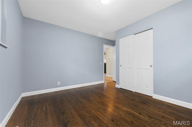 2185 Orleans Ln, Florissant, MO 63031 - unfurnished bedroom with wood finished floors and a closet