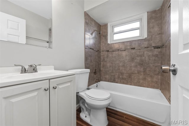 2185 Orleans Ln, Florissant, MO 63031 - full bath featuring vanity, tub / shower combination, and wood finished floors