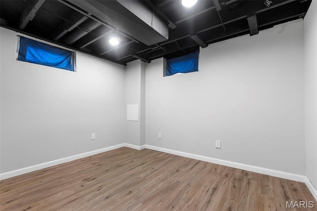 2185 Orleans Ln, Florissant, MO 63031 - finished below grade area featuring wood finished floors and baseboards