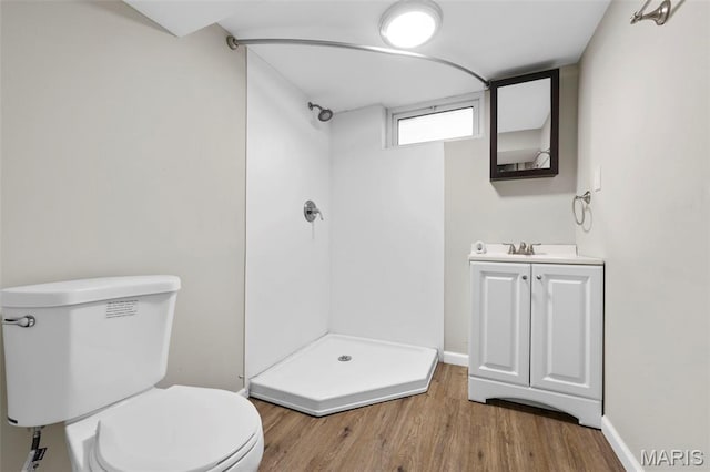 2185 Orleans Ln, Florissant, MO 63031 - full bathroom featuring a shower stall, vanity, and wood finished floors