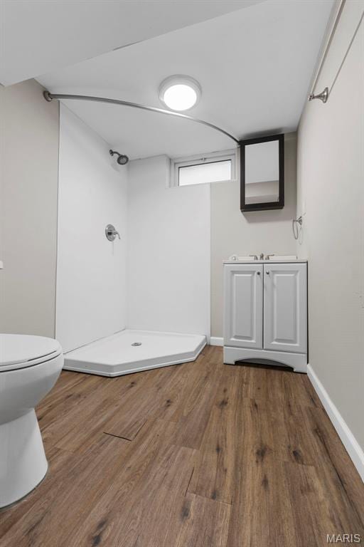 2185 Orleans Ln, Florissant, MO 63031 - full bath featuring a shower stall and wood finished floors