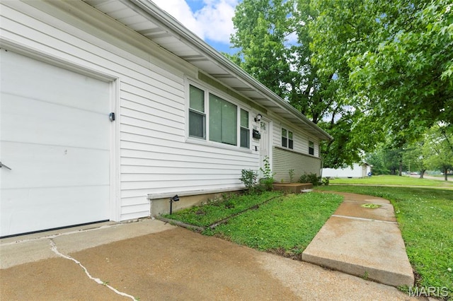 2185 Orleans Ln, Florissant, MO 63031 - doorway to property with a yard and a patio area