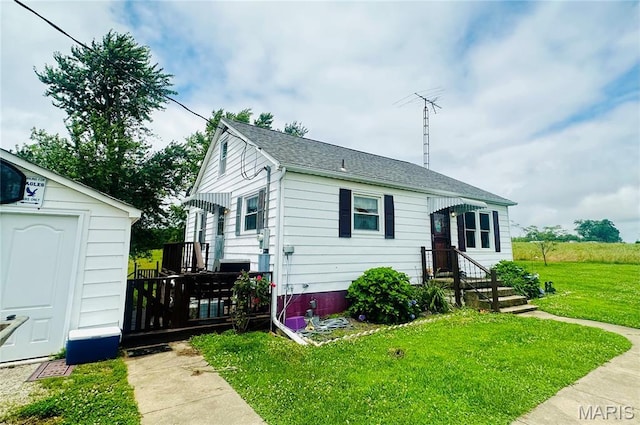 3911 State Route 3, Chester, IL 62233 - bungalow featuring a front lawn, a storage shed, and roof with shingles