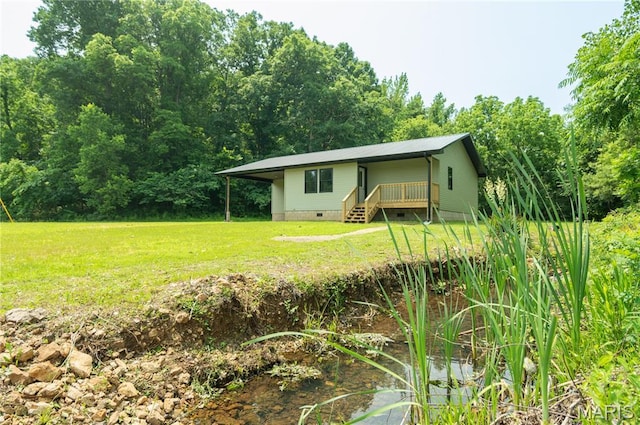 201 W 5th St, Grandin, MO 63943 - view of front of property with a front yard, crawl space, a deck, and a metal roof
