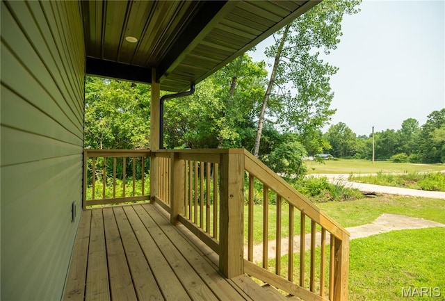 201 W 5th St, Grandin, MO 63943 - deck featuring a lawn and view of wooded area