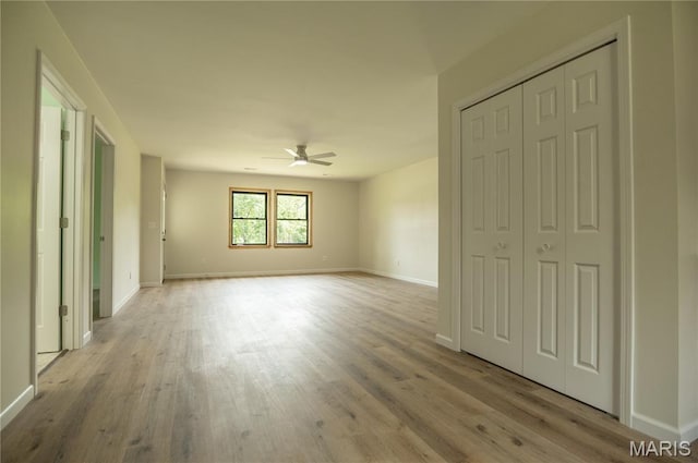 201 W 5th St, Grandin, MO 63943 - unfurnished bedroom featuring light wood finished floors, a ceiling fan, and a closet