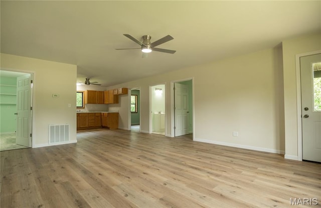 201 W 5th St, Grandin, MO 63943 - unfurnished living room featuring a ceiling fan and light wood-style floors