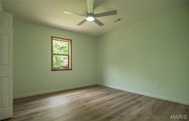 201 W 5th St, Grandin, MO 63943 - empty room with wood finished floors and ceiling fan