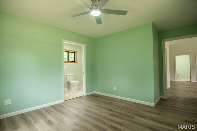 201 W 5th St, Grandin, MO 63943 - unfurnished bedroom with wood finished floors, ensuite bath, and ceiling fan