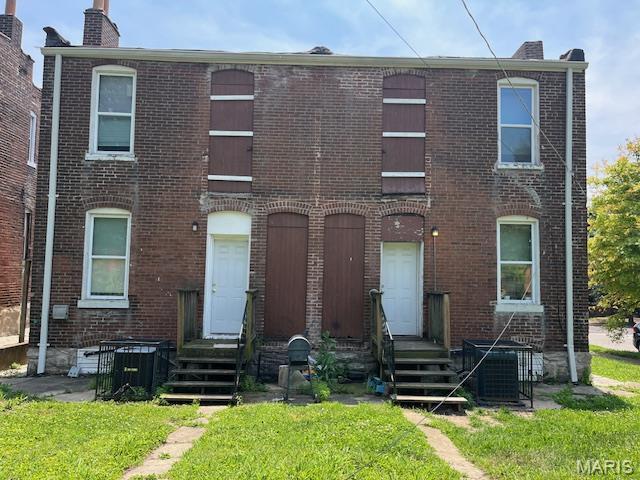 2923 Miami, Saint Louis, MO 63118 - view of property with brick siding, a chimney, and a front yard