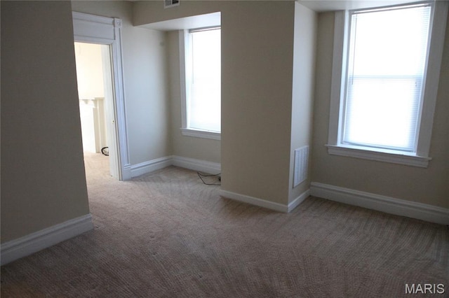 2923 Miami, Saint Louis, MO 63118 - unfurnished room featuring carpet flooring and plenty of natural light
