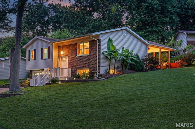 1809 Partridge Dr, Windsor Township, MO 63052 - view of front facade featuring a front yard and brick siding