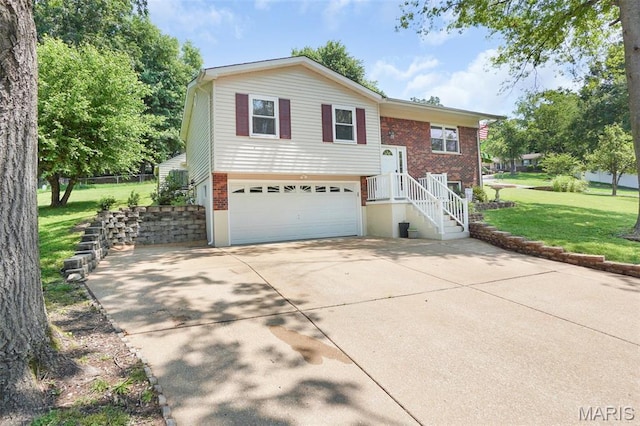1809 Partridge Dr, Windsor Township, MO 63052 - raised ranch featuring brick siding, an attached garage, concrete driveway, and a front lawn