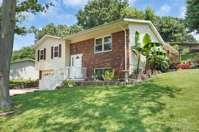 1809 Partridge Dr, Windsor Township, MO 63052 - bi-level home featuring brick siding, an attached garage, and a front yard