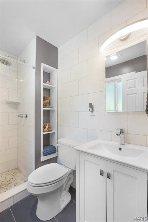 1809 Partridge Dr, Windsor Township, MO 63052 - bathroom featuring tile walls, vanity, tiled shower, and tile patterned floors