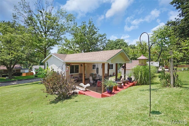 1809 Partridge Dr, Windsor Township, MO 63052 - rear view of property with a yard and roof with shingles