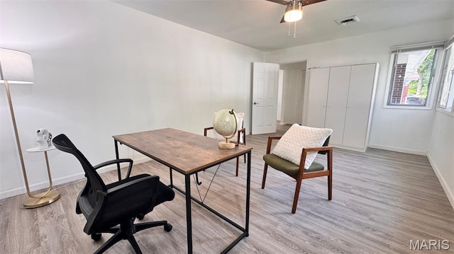 3553 Mckibbon Rd, Saint Louis, MO 63114 - home office with light wood-style floors and a ceiling fan