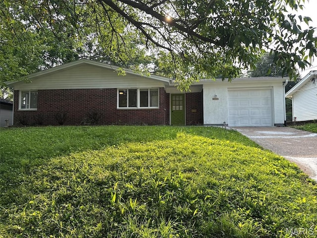 3553 Mckibbon Rd, Saint Louis, MO 63114 - ranch-style home with asphalt driveway, a garage, a front yard, and brick siding