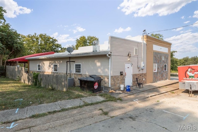 201 Houser St, Park Hills, MO 63601 - back of house with stone siding and a chimney