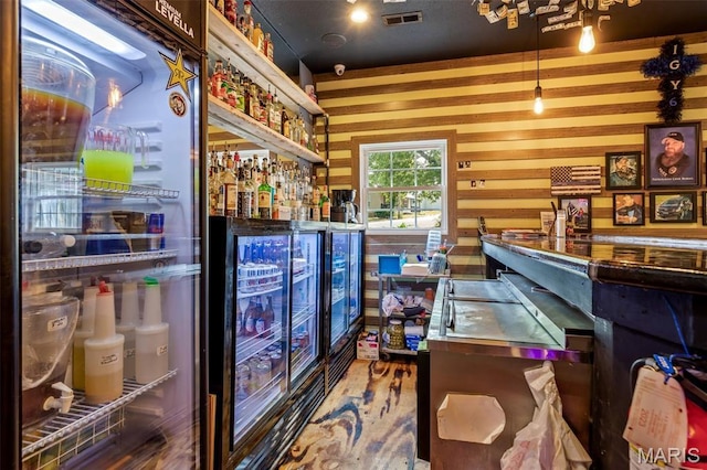 201 Houser St, Park Hills, MO 63601 - recreation room featuring a dry bar, wine cooler, and wood walls