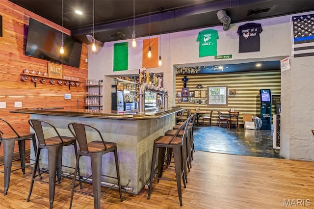201 Houser St, Park Hills, MO 63601 - community bar area featuring wood finished floors, a textured wall, and pendant lighting