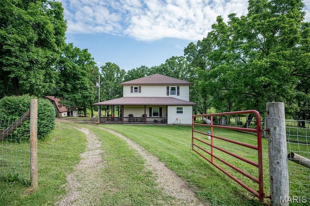 10201 County Road 5440, Rolla, MO 65401 - farmhouse with driveway and a metal roof