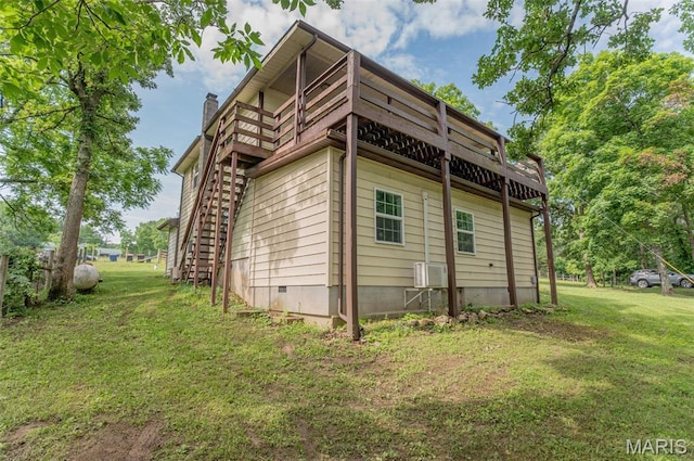 10201 County Road 5440, Rolla, MO 65401 - view of property exterior featuring a yard, a balcony, and a chimney