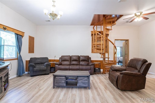 10201 County Road 5440, Rolla, MO 65401 - living room with wood finished floors, stairway, a chandelier, and ceiling fan