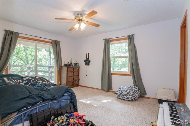 10201 County Road 5440, Rolla, MO 65401 - bedroom featuring carpet flooring, ceiling fan, and a textured ceiling