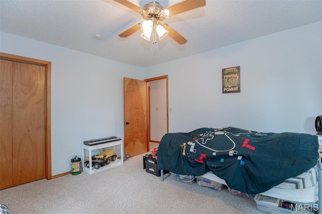10201 County Road 5440, Rolla, MO 65401 - bedroom featuring carpet flooring, a ceiling fan, a textured ceiling, and a closet