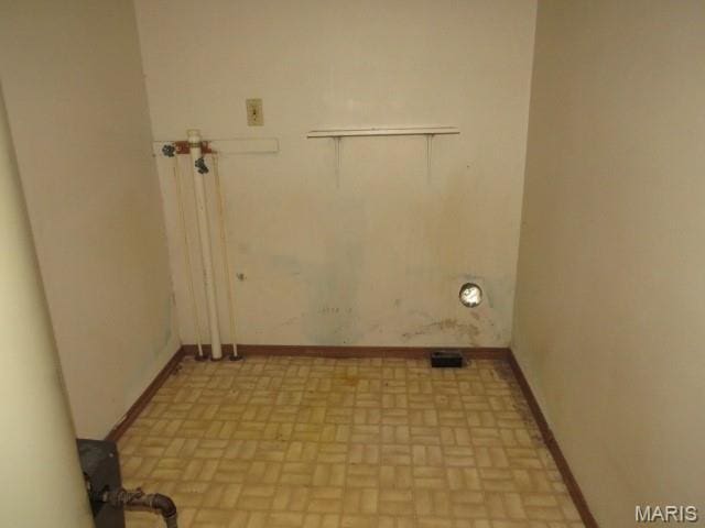 705 S Arch St, Jerseyville, IL 62052 - laundry room featuring brick patterned floors