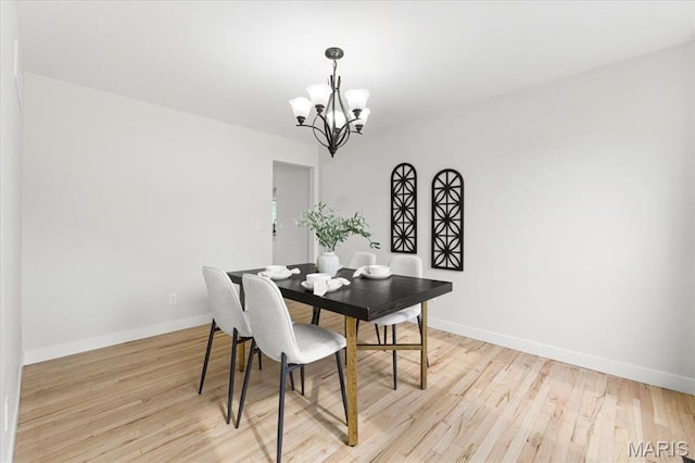 4507 Behlmann Grove Pl, Florissant, MO 63034 - dining area featuring a chandelier and light wood-style floors