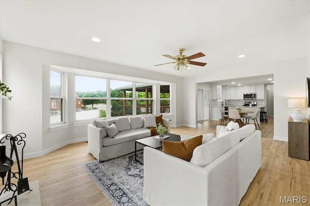 4507 Behlmann Grove Pl, Florissant, MO 63034 - living area with light wood-style floors, ceiling fan, and recessed lighting