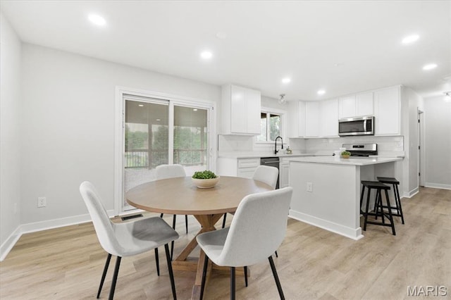 4507 Behlmann Grove Pl, Florissant, MO 63034 - dining area with light wood-type flooring and recessed lighting