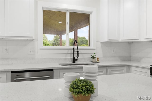 4507 Behlmann Grove Pl, Florissant, MO 63034 - kitchen featuring white cabinetry, stainless steel dishwasher, and light stone counters