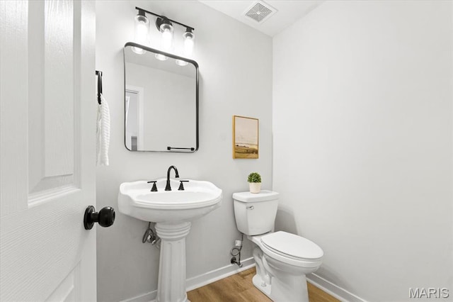 4507 Behlmann Grove Pl, Florissant, MO 63034 - bathroom with wood finished floors and baseboards